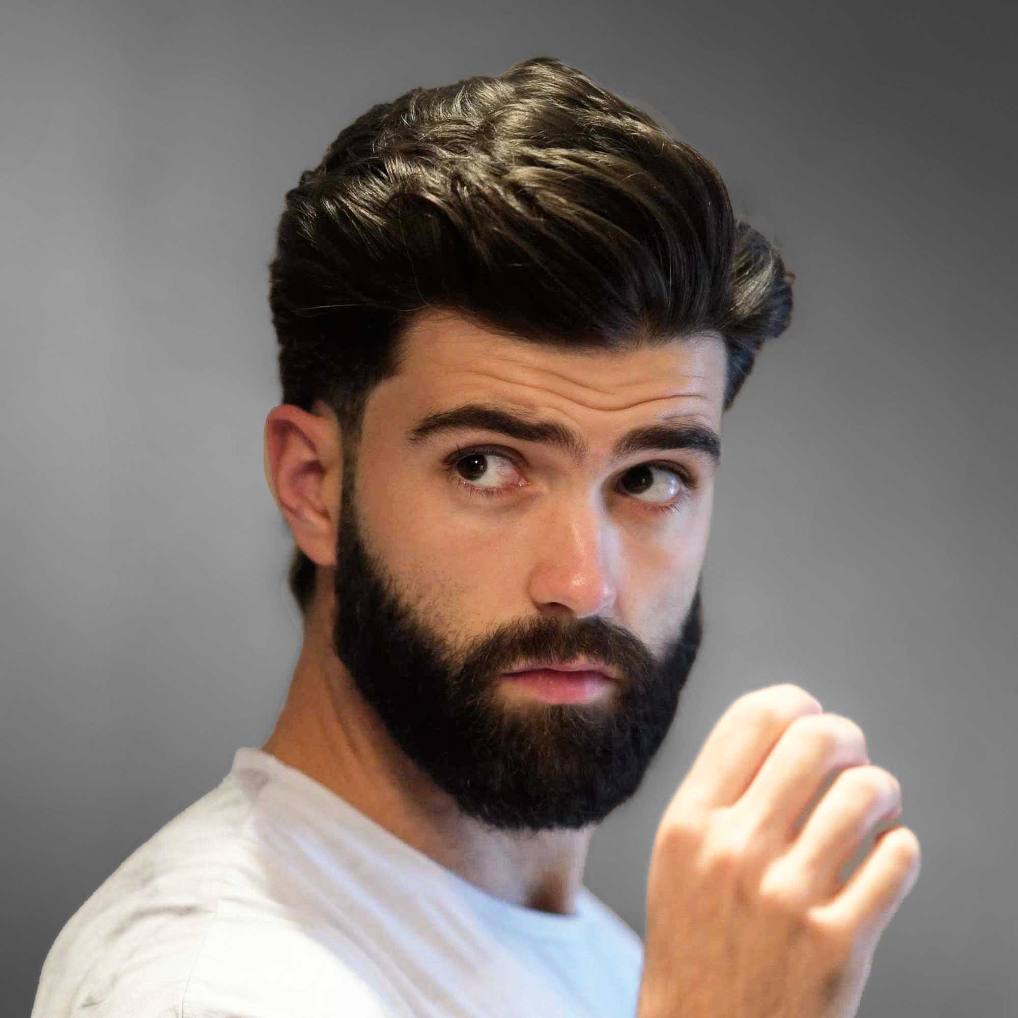 Male model applying BLUMAAN Heavy Hold Clay to style thick hair with strong hold